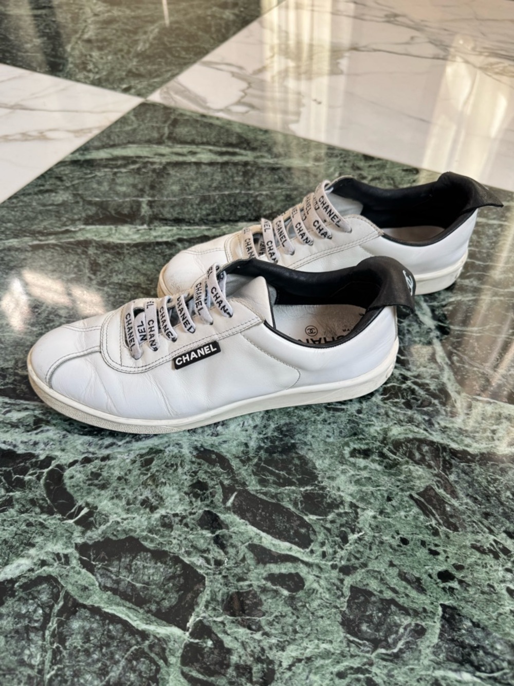 CHANEL White Leather Sneakers with Black Heel Accent